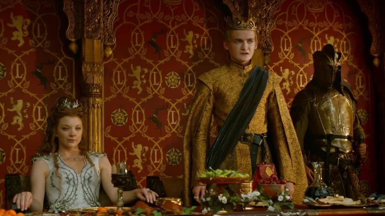 Joffrey making a proclamation as Margery sits beside him 
