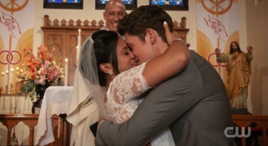 Jane and Michael kissing at the altar