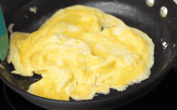 Scrambling eggs in a pan