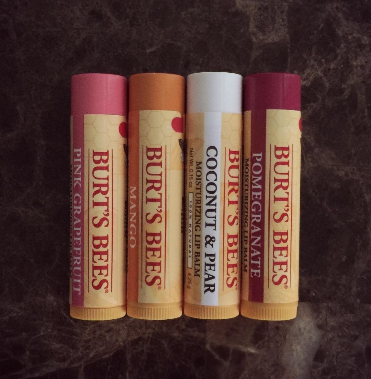 The four pack of different flavored lip balms 