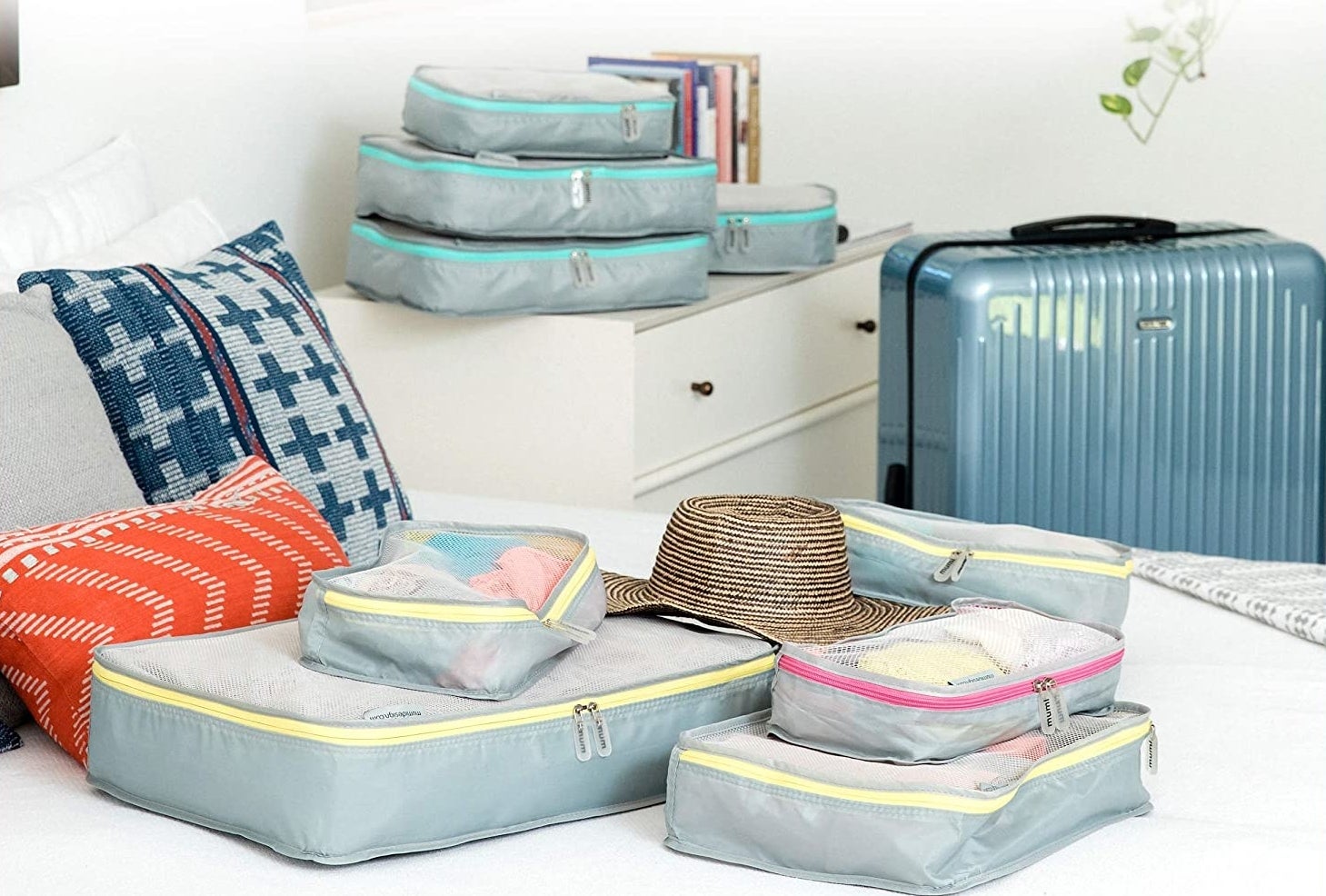 the mimu packing organizers on a bed