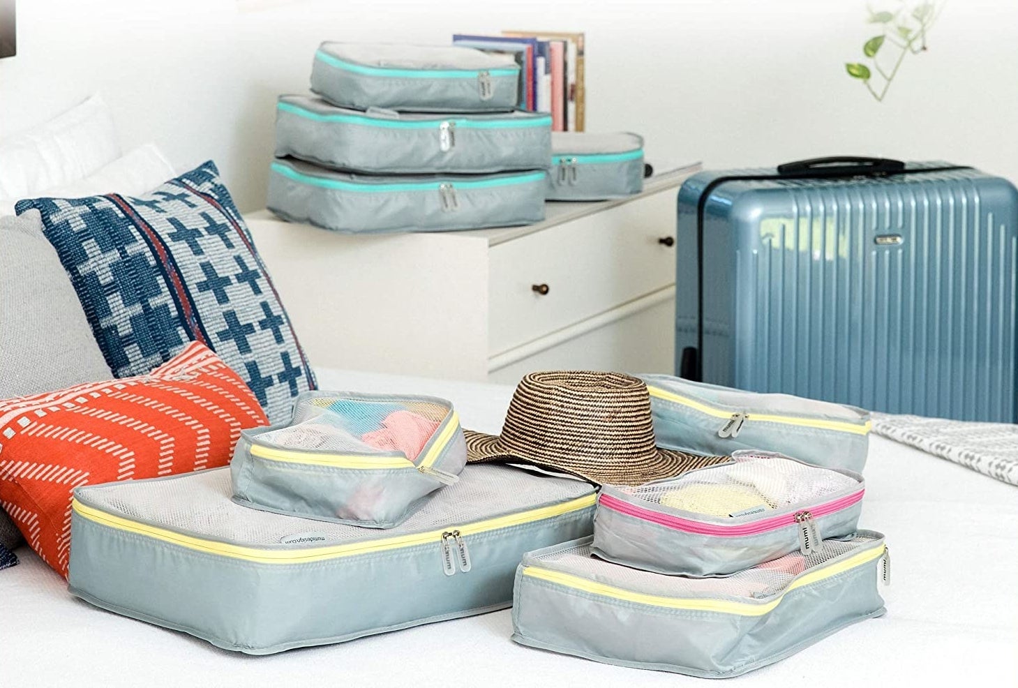 the mimu packing organizers on a bed