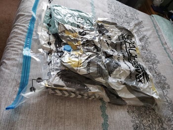 reviewer image of the same spacesaver storage bag full of blankets vacuum sealed