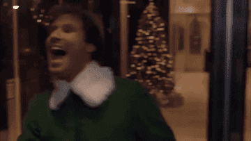 Elf (played by Will Ferrel) excited to run in circles through a rotating door 