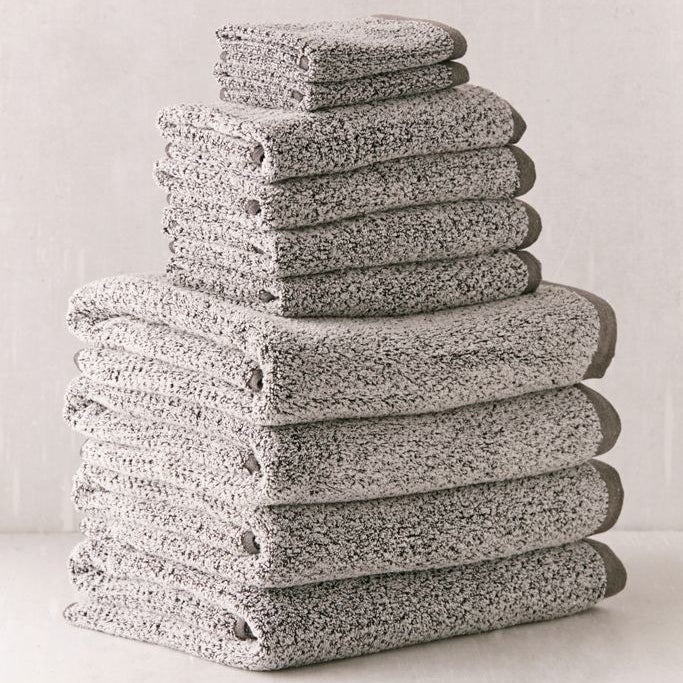Gray towels staked on top of each other