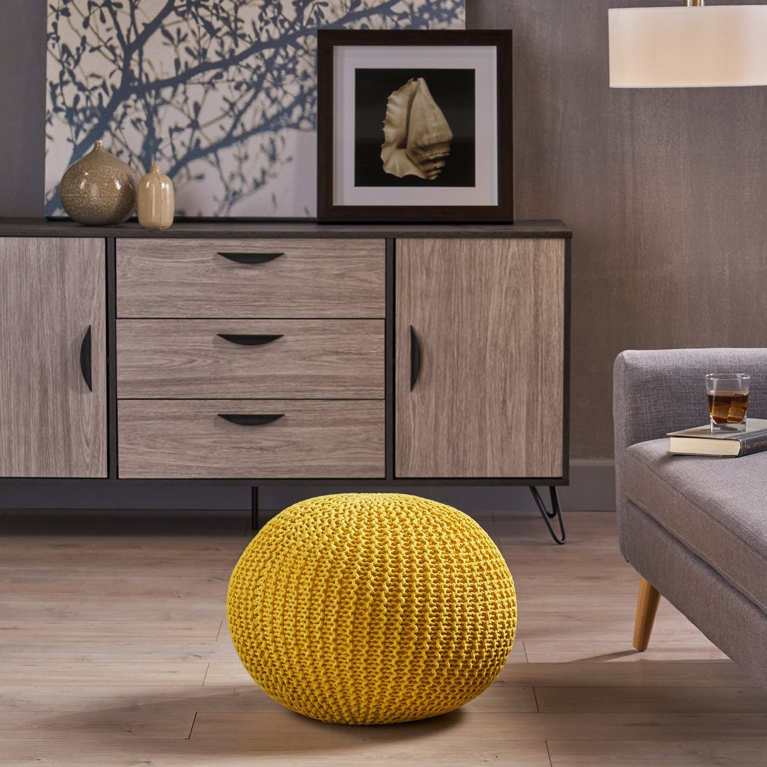 The pouf placed in front of a couch