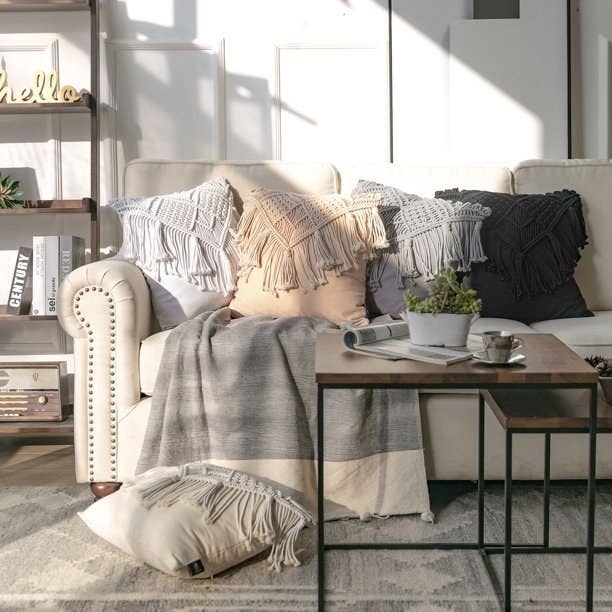 The pillows in different colors arranged on a couch