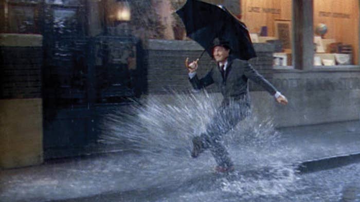 Frank Sinatra dancing in the rain and splashing around