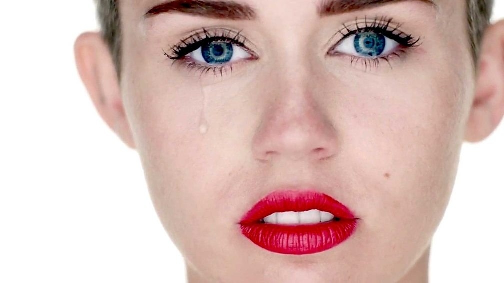 Miley Cyrus crying in her music video for her song Wrecking Ball