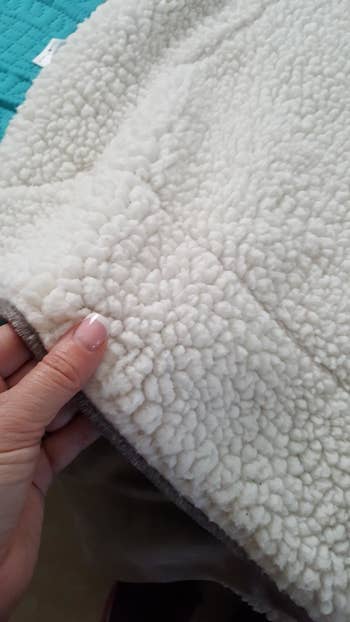 The white fleece lining of the blanket