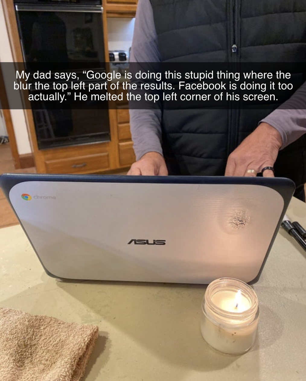 computer next to a candle and there&#x27;s a burn mark near the candle