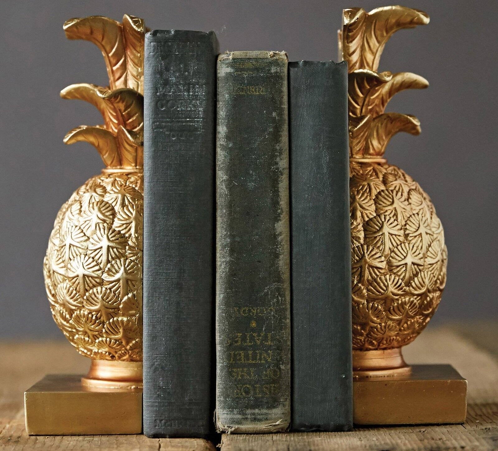 The bookends keeping three books upright