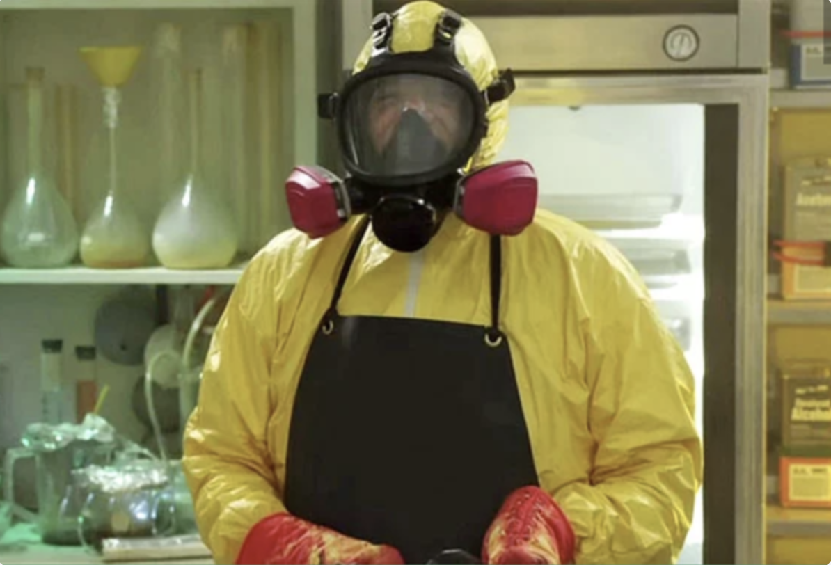 A man (Billy Murray) wearing a gas mask and plastic safety suit