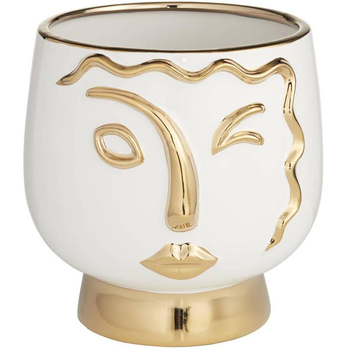 White vase with gold details