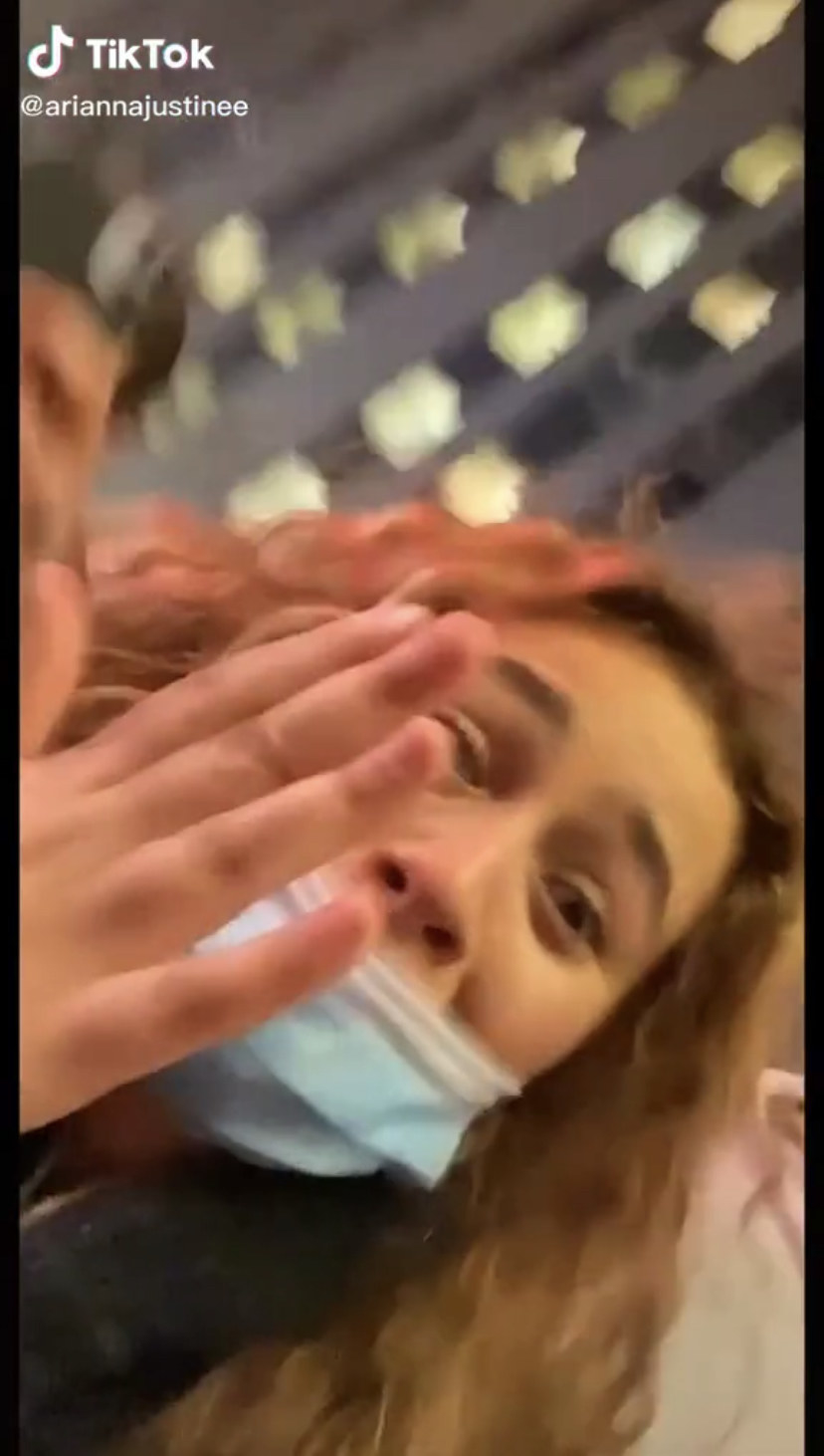 A fan holding up her hand, shocked