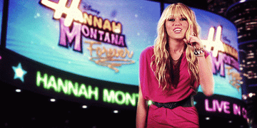 Miley Cyrus, as Hannah Montana, smiles and brings a finger to her lips to gesture keeping a secret in the opening theme for &quot;Hannah Montana&quot;
