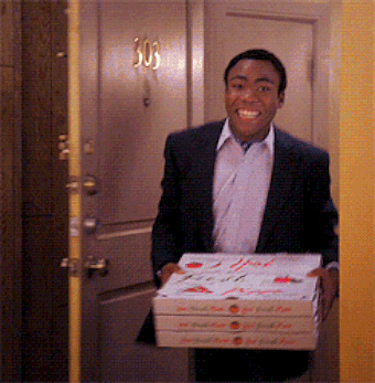 Troy walks in with pizza to see the room on fire