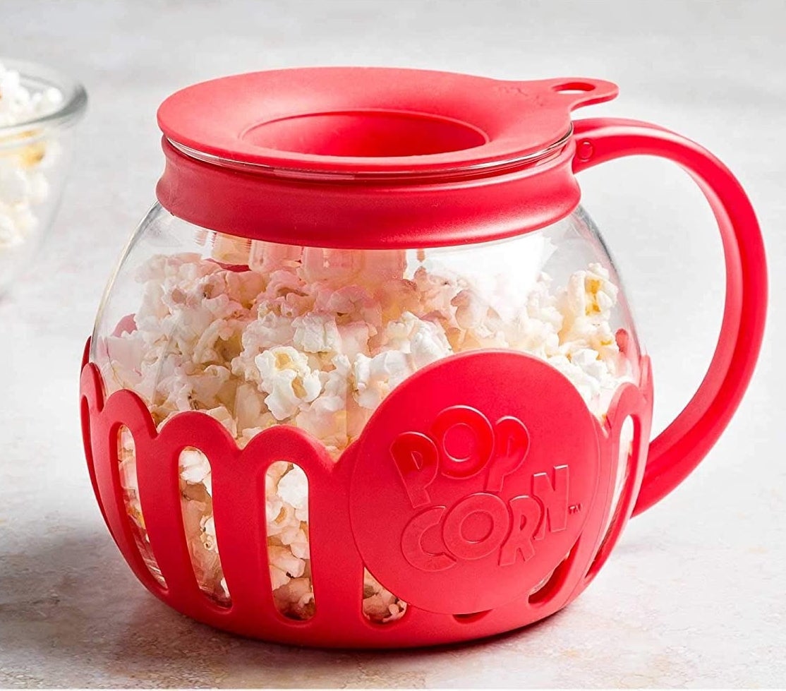 The popcorn popper filled with popcorn