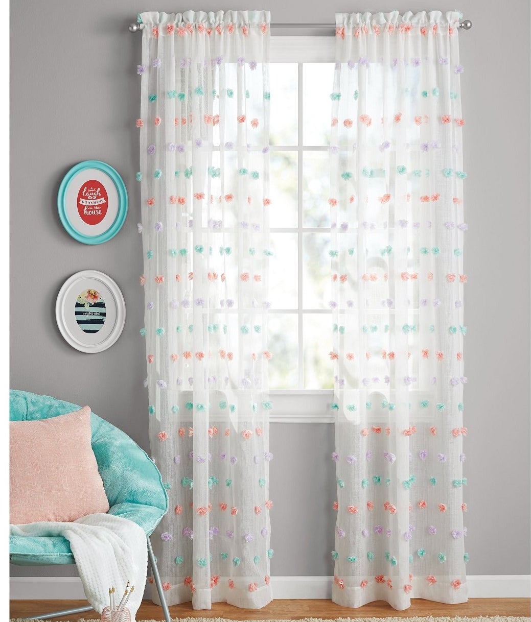 The curtains hung up in a pastel room