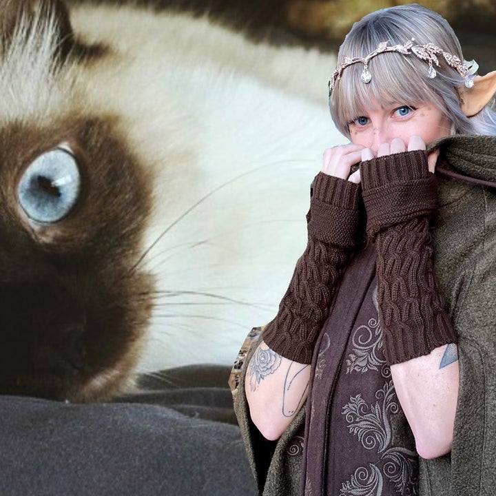 A photo of Kelly in a fairy costume next to her cat