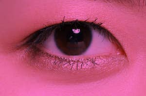 an eye and face that's been color pink