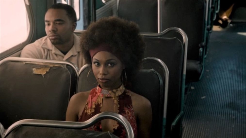 Randall&#x27;s mum sitting down on a weathered chair in a bus