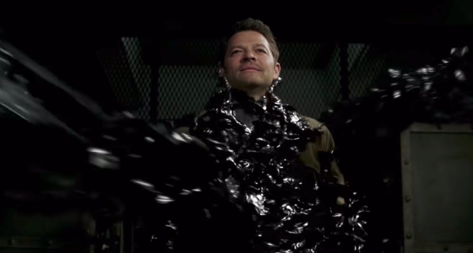 Castiel being enveloped by a black goo-like substance 