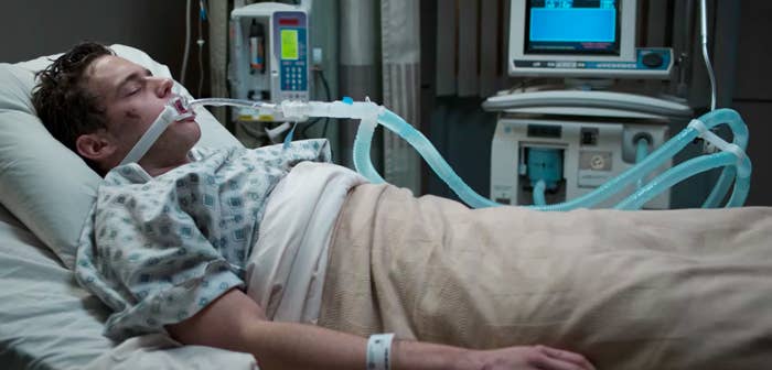 Justin lying down in a hospital bed