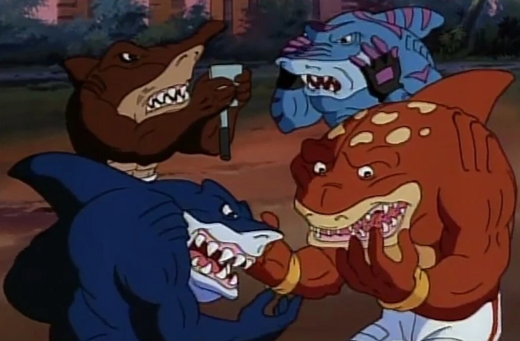 The Street Sharks examine themselves looking horrified 