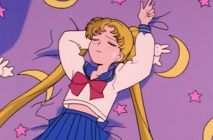Serena/Usagi lying on a bed and crying