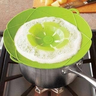 A green spill stopper on a pot