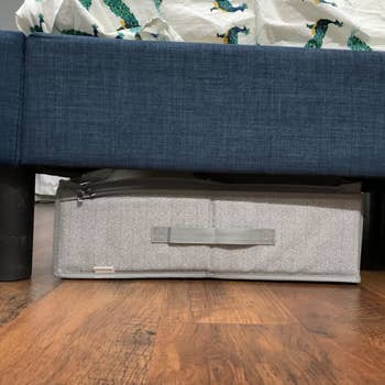 Reviewer photo showing the underbed storage container under their bed