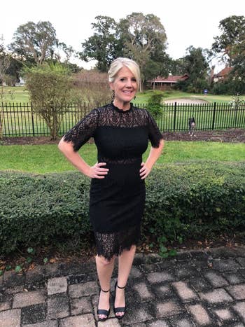 A different reviewer wearing the dress in black