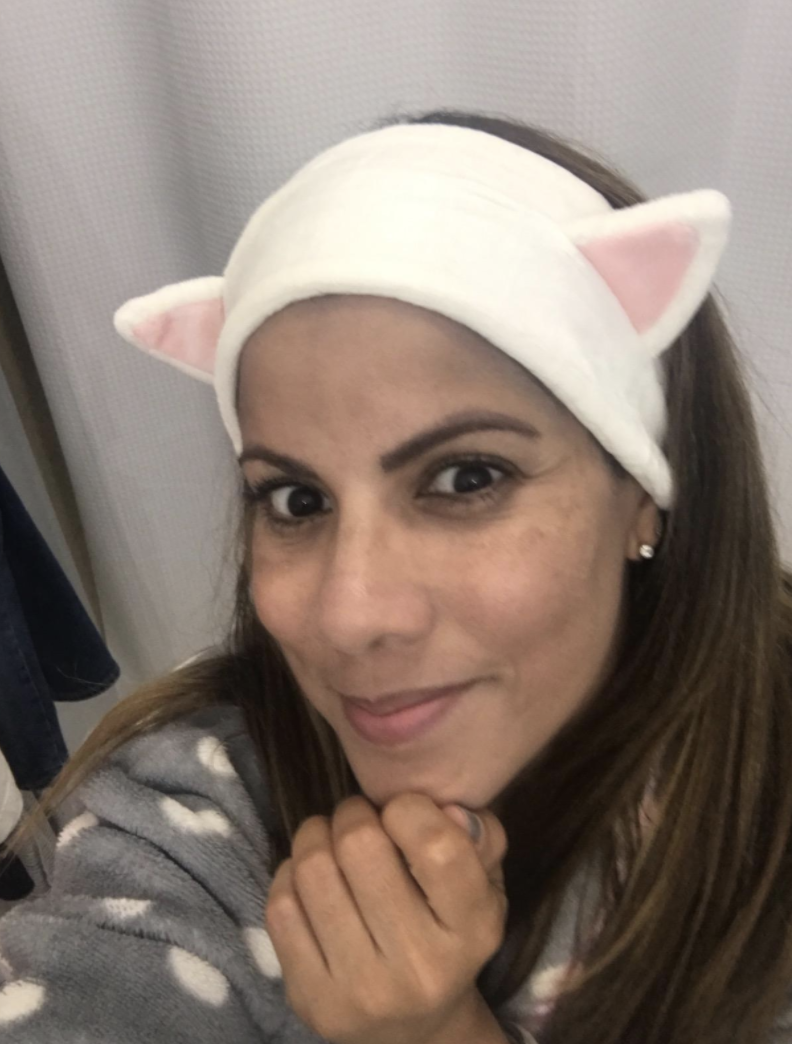 Customer wears kitten headband 