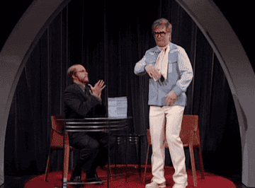 A gif of Alec Baldwin dressed as Elton John from SNL making a dramatic finish