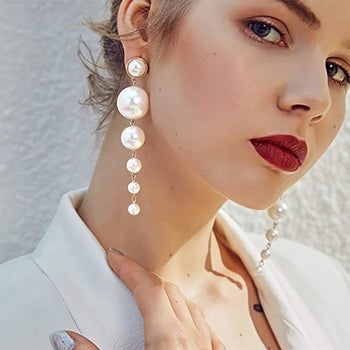 A model wearing the earrings