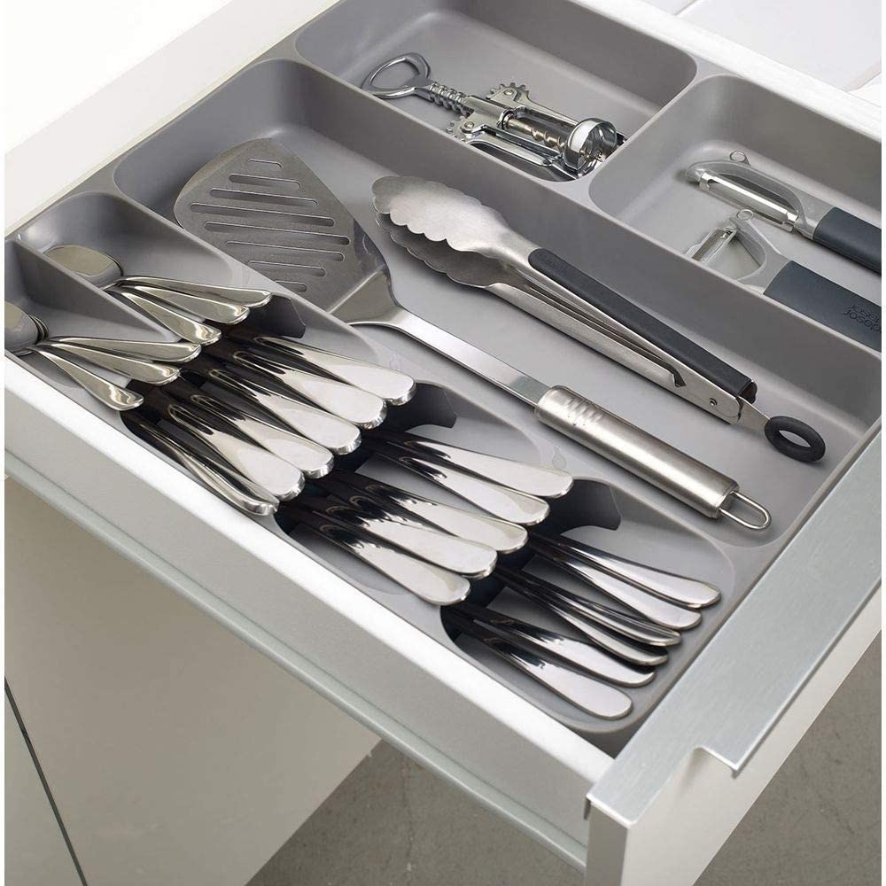 An open drawer with the cutlery organizer inside