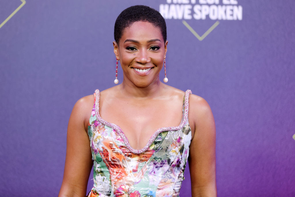 Tiffany Haddish wearing a colorful dress on the E! People&#x27;s Choice Awards red carpet in 2020 