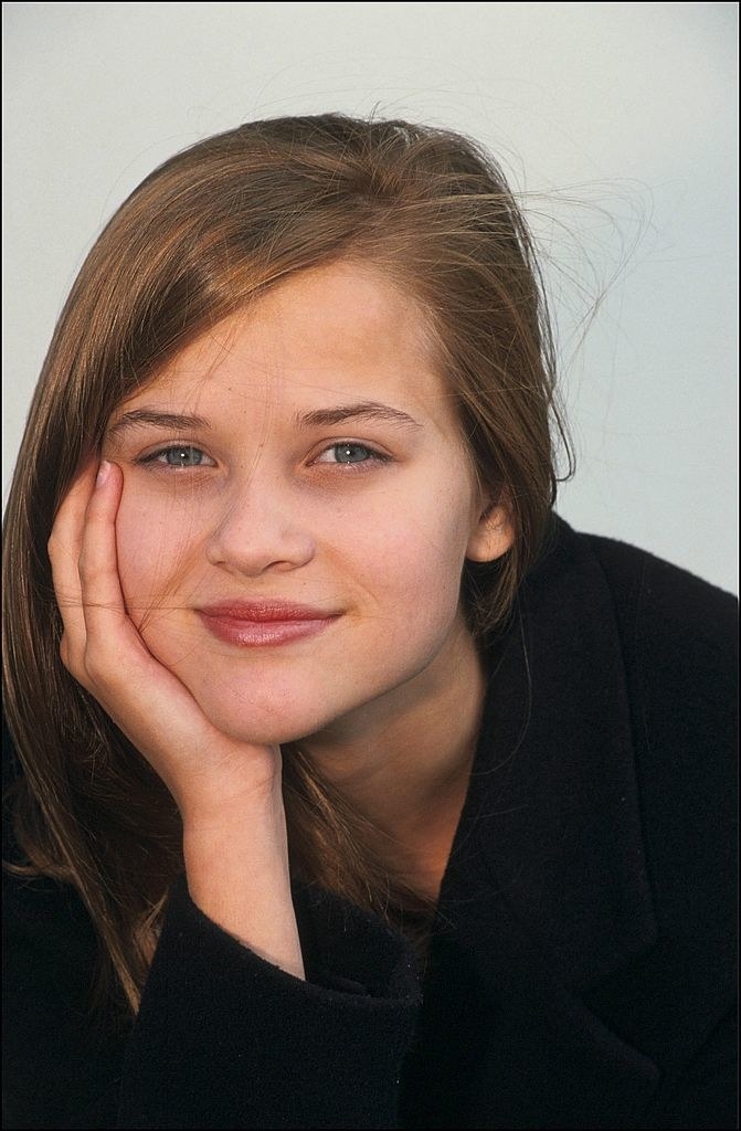 Reese Witherspoon posing for a portrait -- her chin in her hand -- at the Deauville Festival Film in 1991