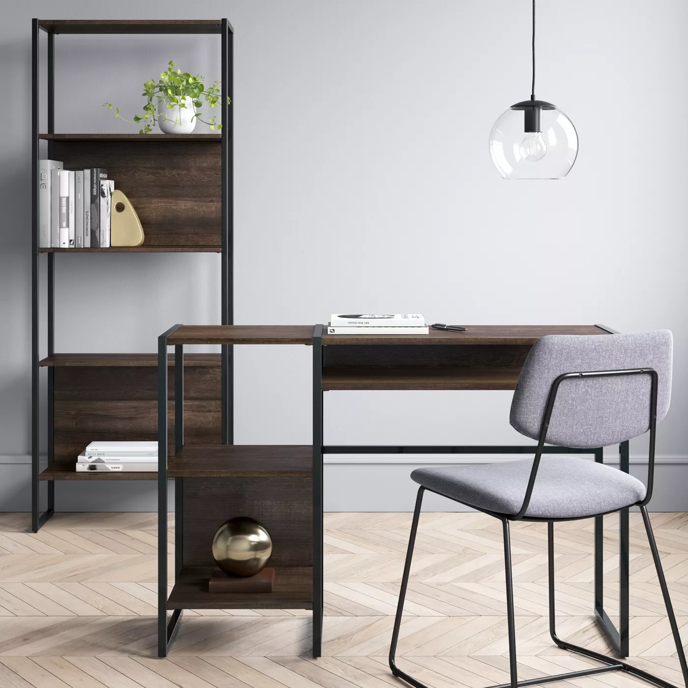 The brown and black desk with two open shelves and an open drawer
