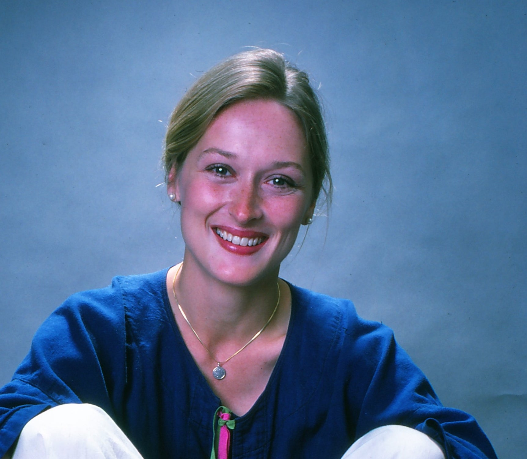 Meryl smiling in a blue top smiling towards the camera