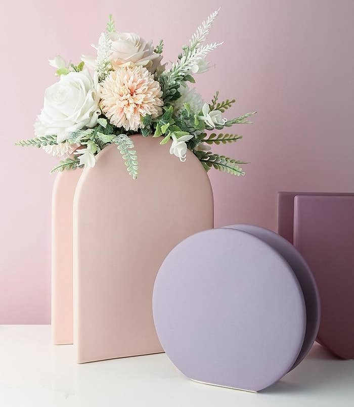 Two of the geometric vases in light purple and pink