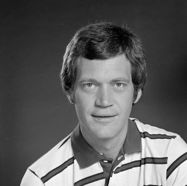Publicity photo of David where he is wearing a striped polo