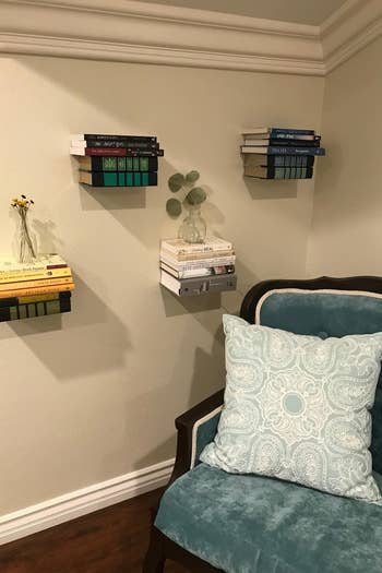 reviewer photo showing floating shelves used to decorate a wall 