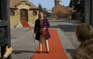 A GIF of Wonka falling forward and then doing a surprise somersault