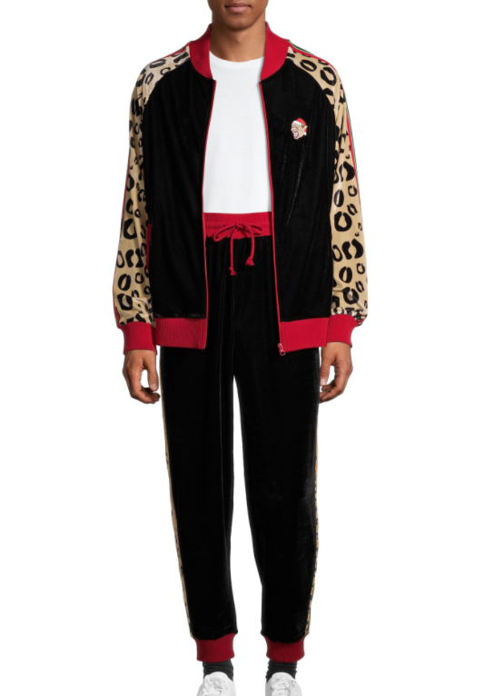 A black tracksuit with cheetah pattern sleeves and a small design of a cheetah&#x27;s head in a Santa hat. 