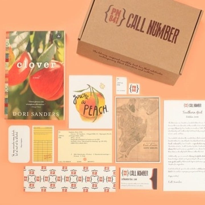 A flat lay of a box, book, various documents, maps, a library, and more! 