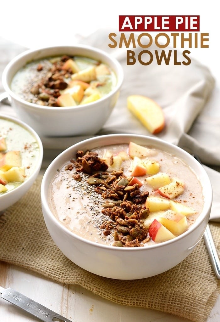 An apple smoothie with chopped nuts and chia seed toppings in a bowl