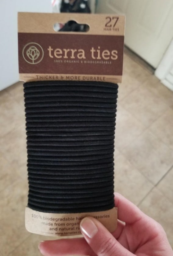 A pack of 27 black, organic hair ties.