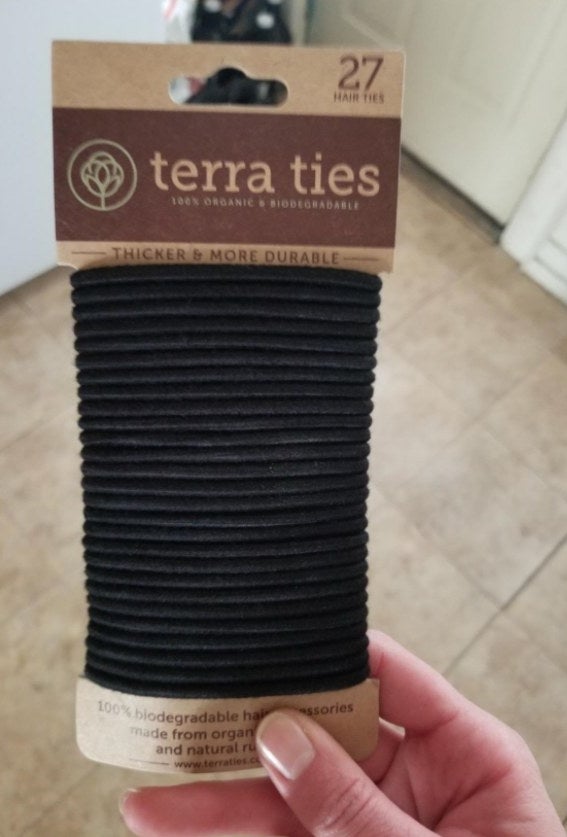 A pack of 27 black, organic hair ties.